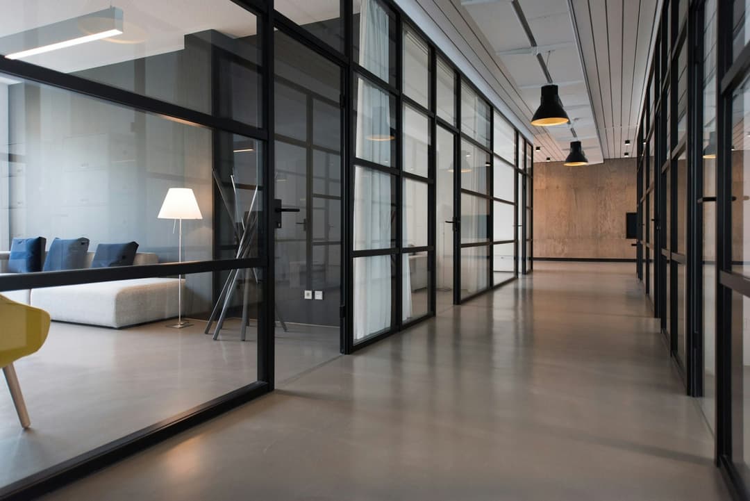 Glass-walled studio corridor at Starq Labs